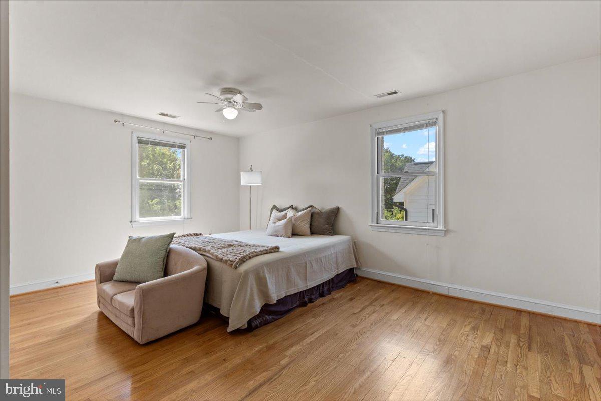 6023 Walhonding Road Bethesda, MD 20816 - Photo 20 of 37 a spacious bedroom with a bed and window