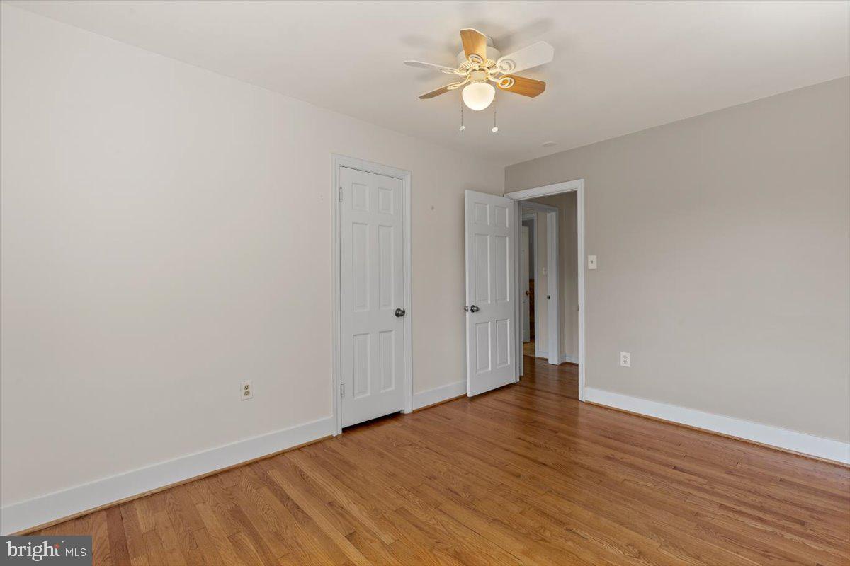 6023 Walhonding Road Bethesda, MD 20816 - Photo 25 of 37 wooden floor in an empty room with a window