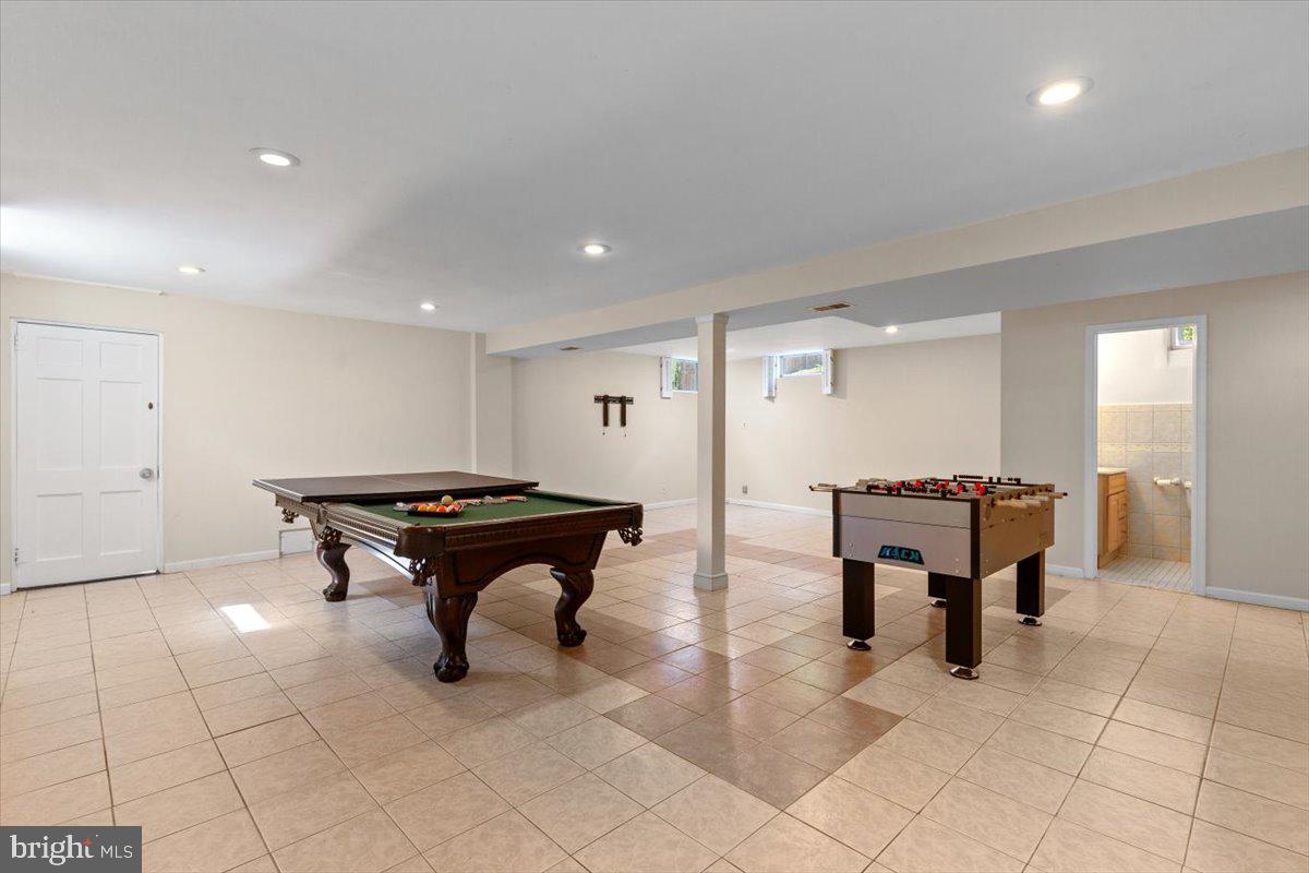 6023 Walhonding Road Bethesda, MD 20816 - Photo 27 of 37 a room with furniture a table and a rug