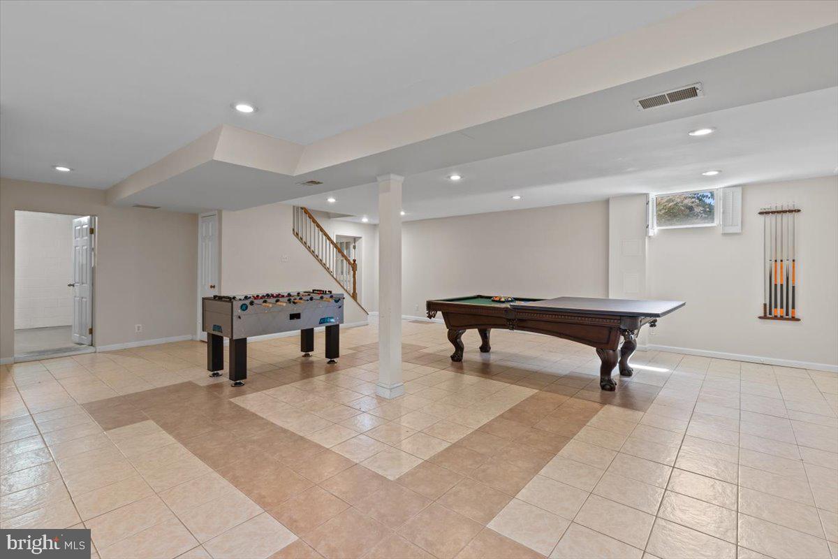 6023 Walhonding Road Bethesda, MD 20816 - Photo 28 of 37 a room with lots of furniture and white walls