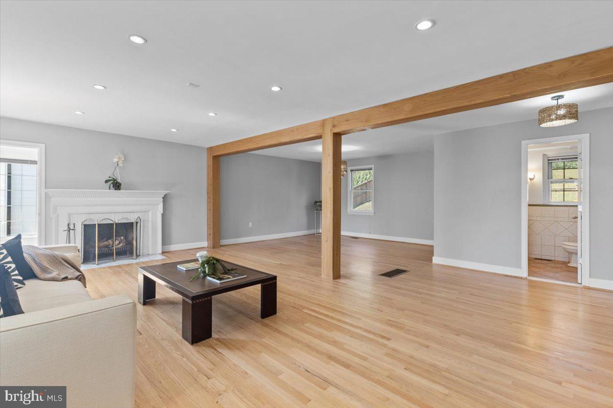 6023 Walhonding Road Bethesda, MD 20816 - Photo 7 of 37 a living room with furniture and a fireplace