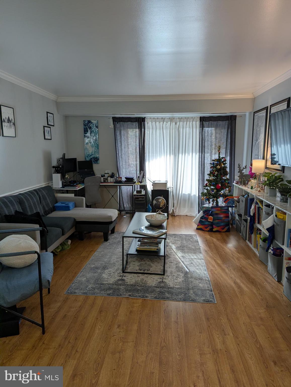 5940 Cove Landing Road, Unit 304 Burke, VA 22015 - Photo 2 of 11 a living room with furniture and a window