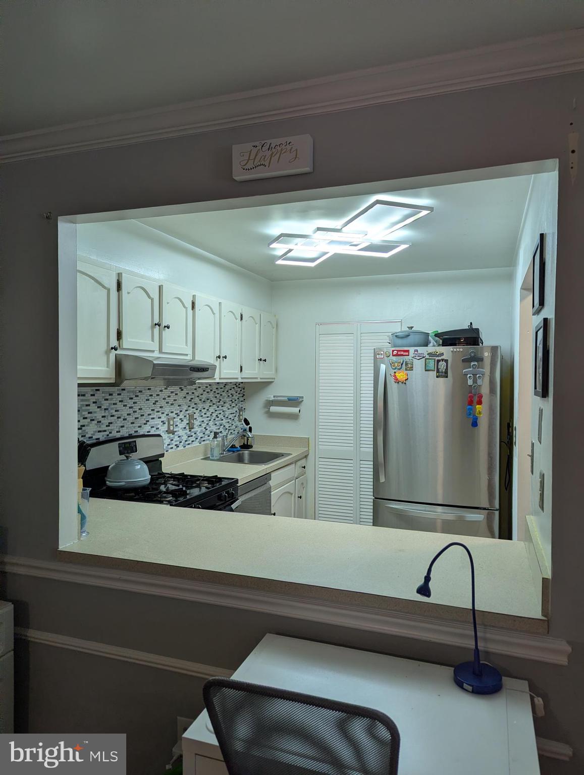 5940 Cove Landing Road, Unit 304 Burke, VA 22015 - Photo 3 of 11 a bathroom with a sink and mirror