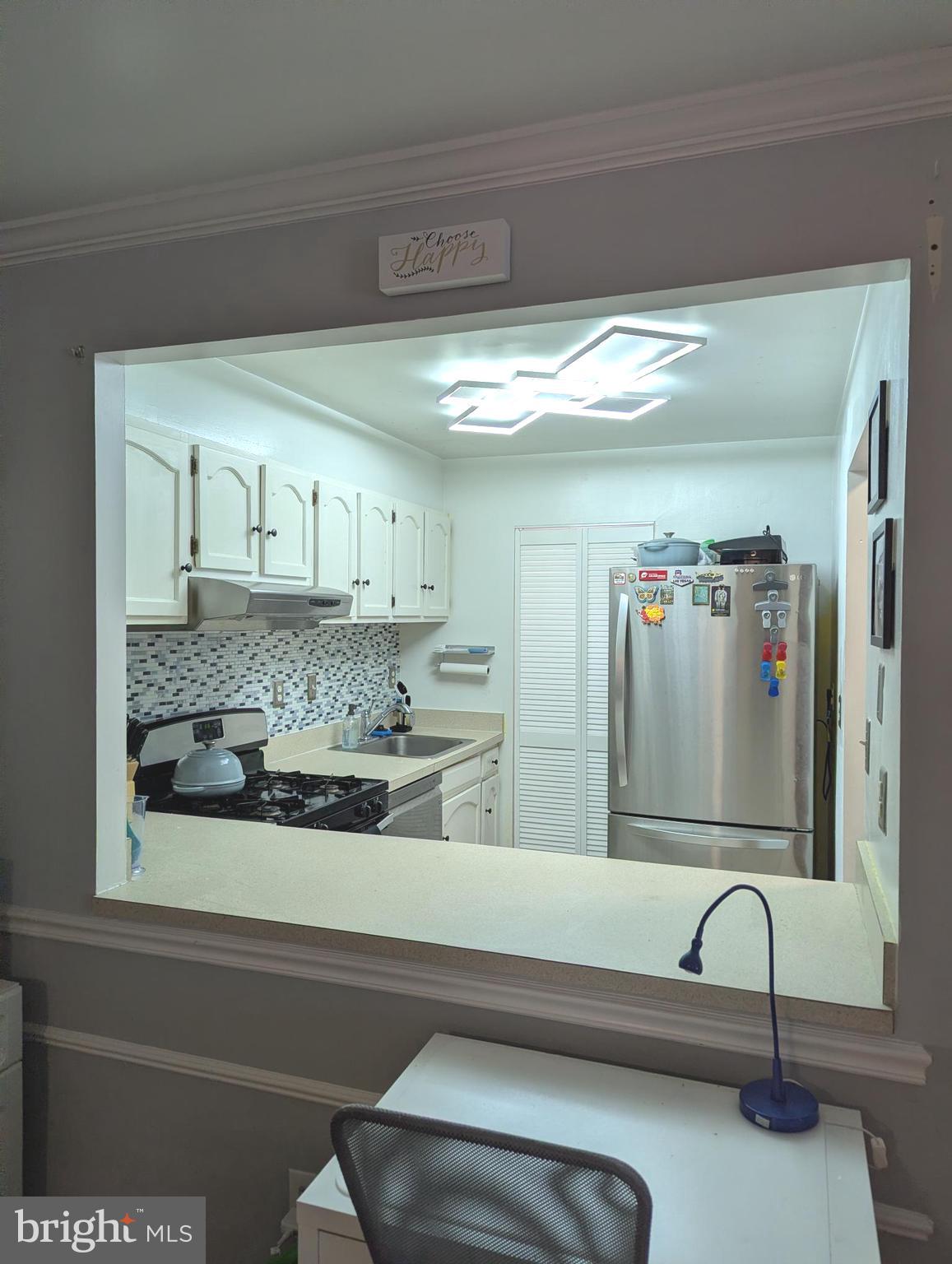 5940 Cove Landing Road, Unit 304 Burke, VA 22015 - Photo 4 of 13 Dining to kitchen