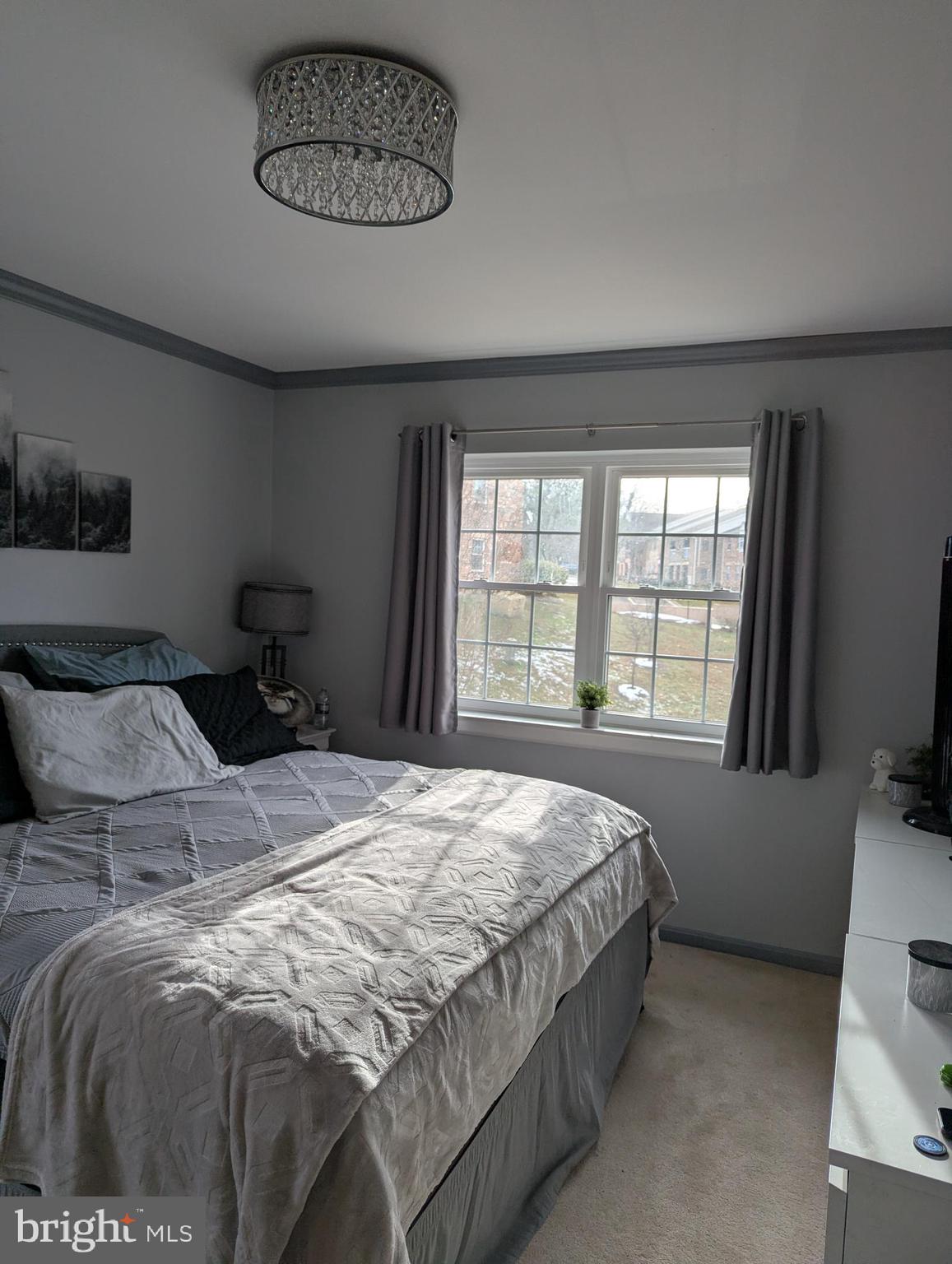 5940 Cove Landing Road, Unit 304 Burke, VA 22015 - Photo 9 of 11 a bedroom with a bed and a window