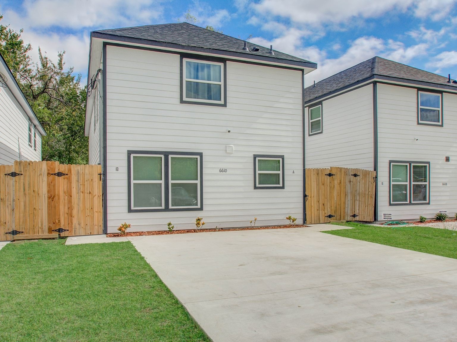 6610 Haight Street, Unit A Houston, TX 77028 - Photo 1 of 31 a front view of a house with a yard and garage