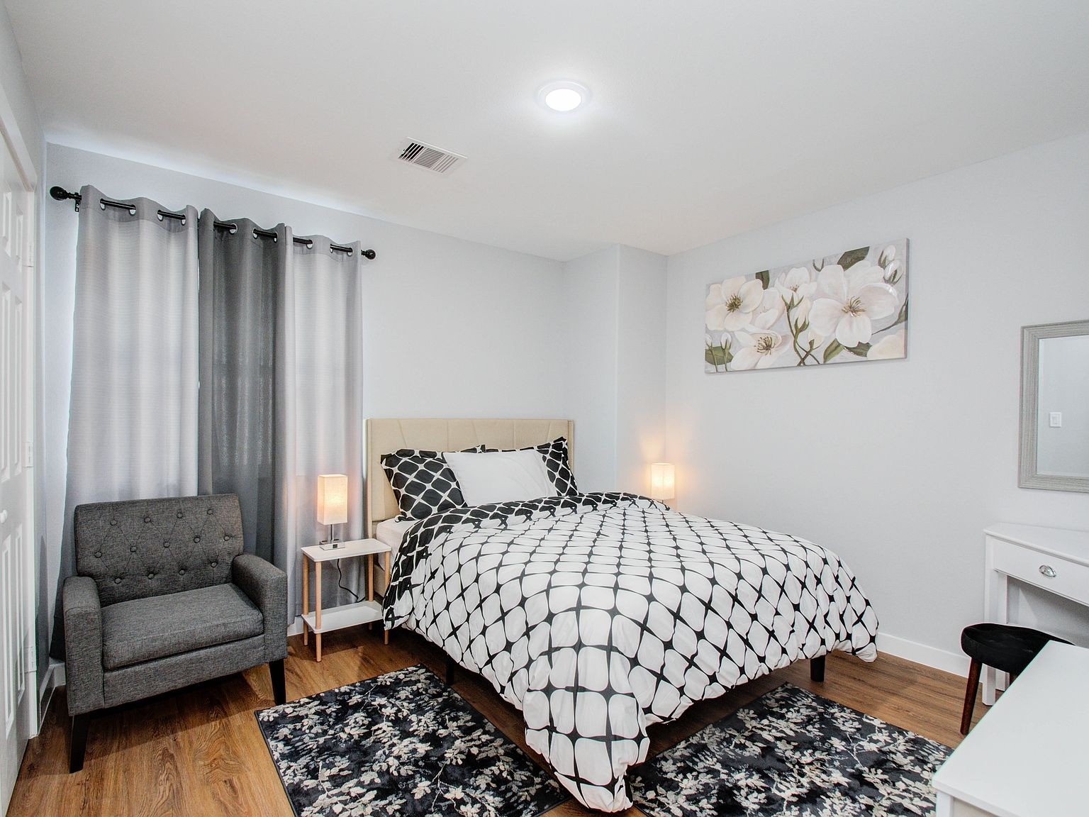 6610 Haight Street, Unit A Houston, TX 77028 - Photo 21 of 31 a bedroom with a bed and a couch