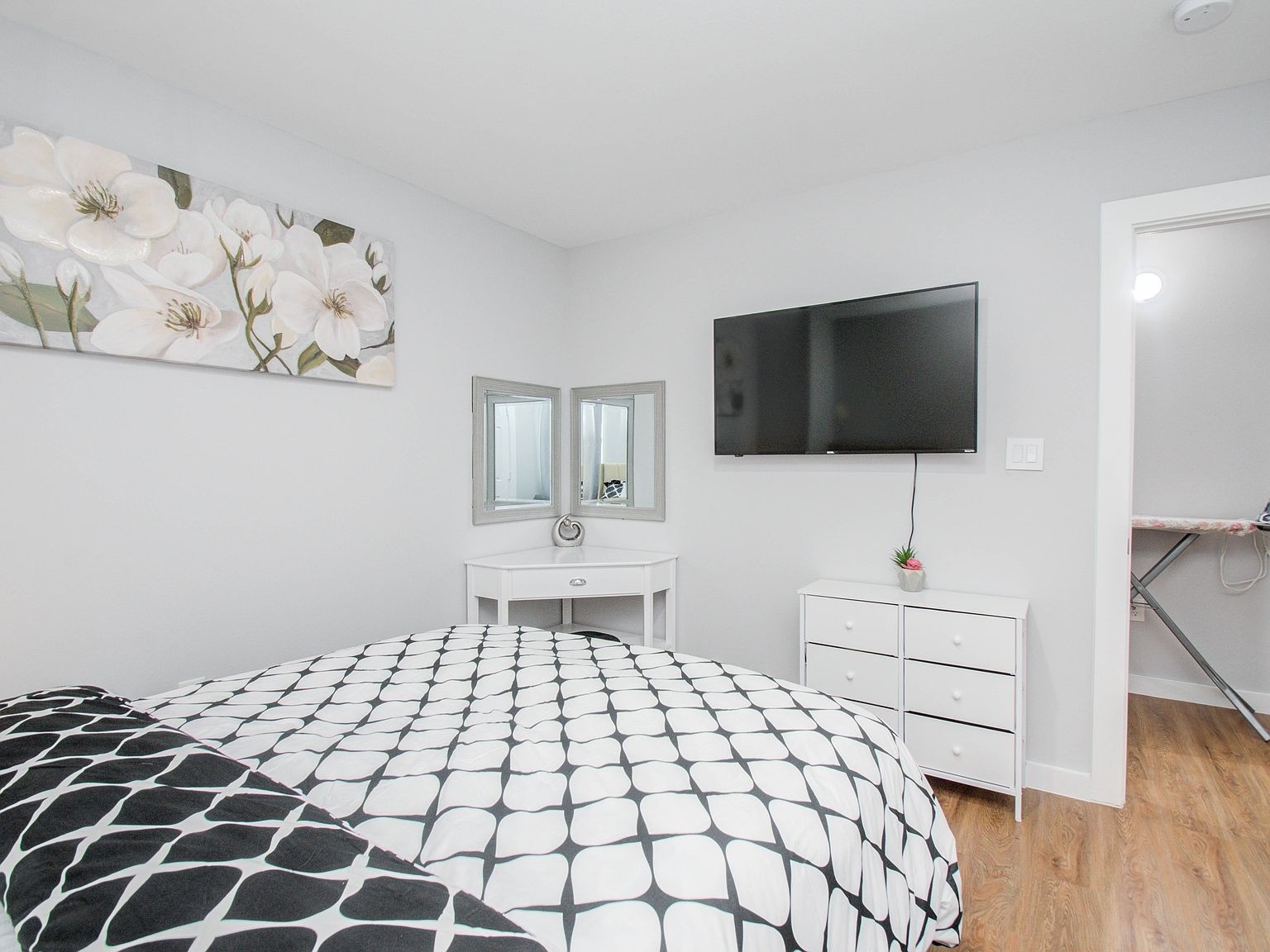 6610 Haight Street, Unit A Houston, TX 77028 - Photo 22 of 31 a bedroom with a bed and a flat screen tv