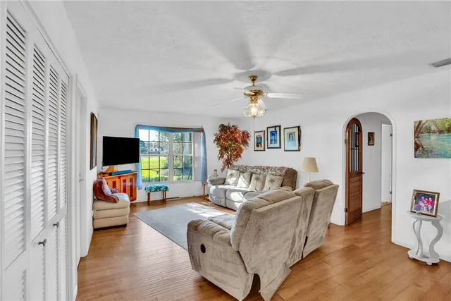 a bedroom with furniture and a chandelier