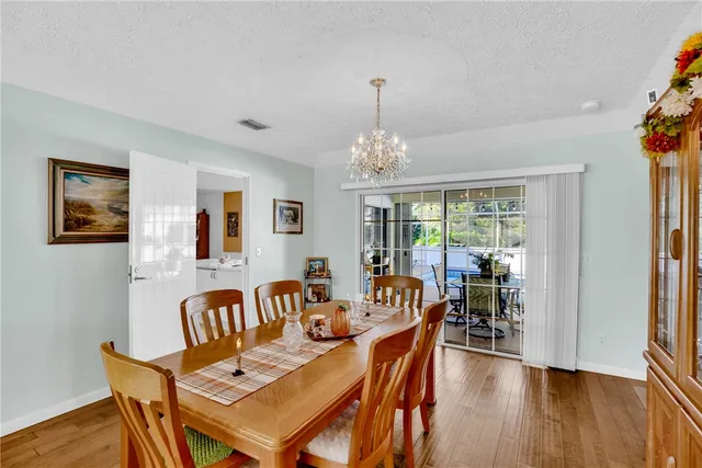 a bedroom with furniture and a chandelier