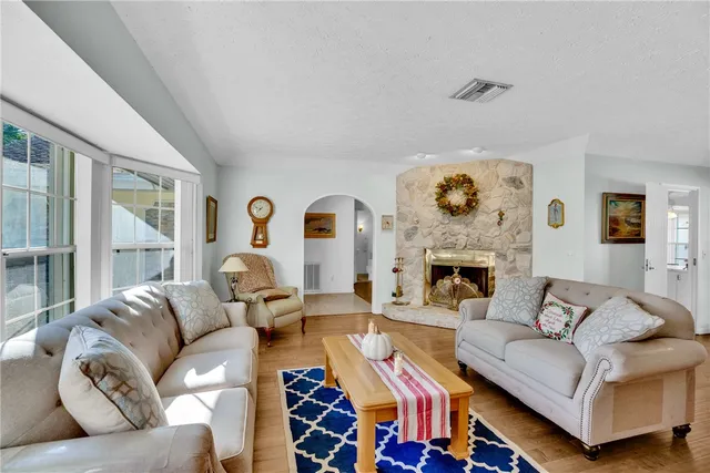 a bedroom with a bed and flat screen tv