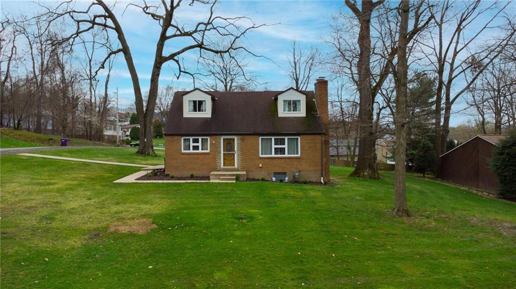 203 Oak Road Pittsburgh, PA 15239 - Photo 1 of 32 a view of a house with a yard