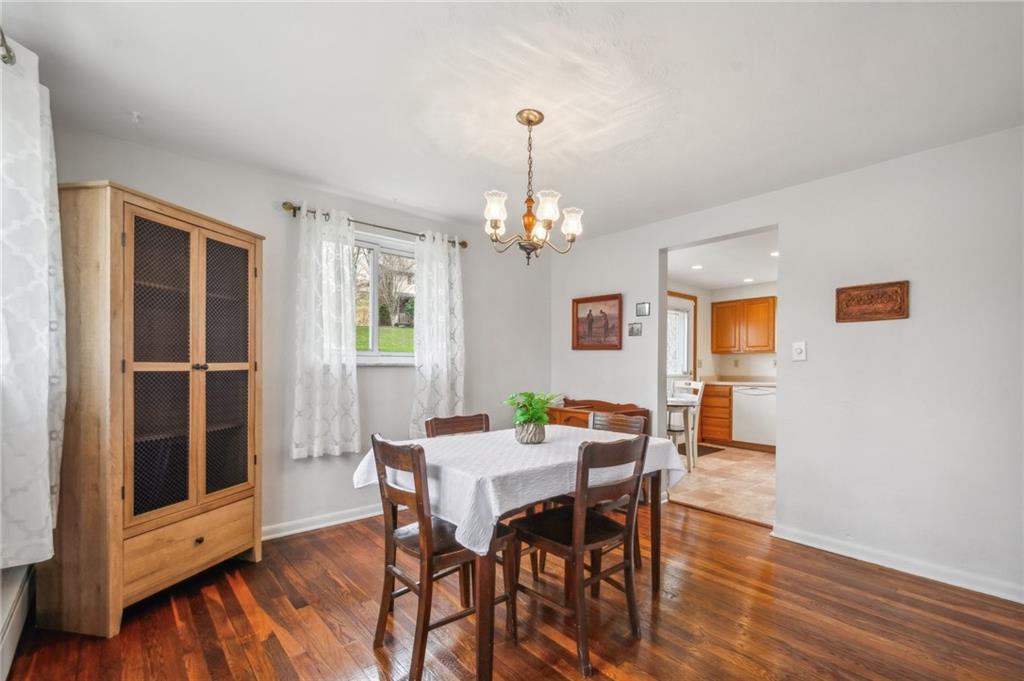 203 Oak Road Pittsburgh, PA 15239 - Photo 12 of 32 a view of a dining room with furniture and wooden floor