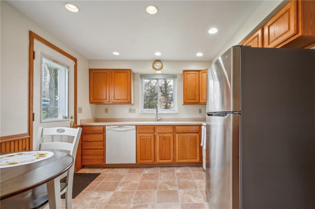 203 Oak Road Pittsburgh, PA 15239 - Photo 13 of 32 a kitchen with stainless steel appliances granite countertop a refrigerator and a sink