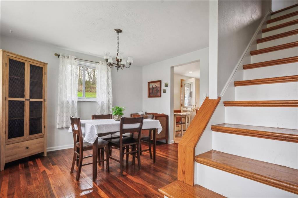 203 Oak Road Pittsburgh, PA 15239 - Photo 6 of 32 a view of a dining room with furniture window and wooden floor