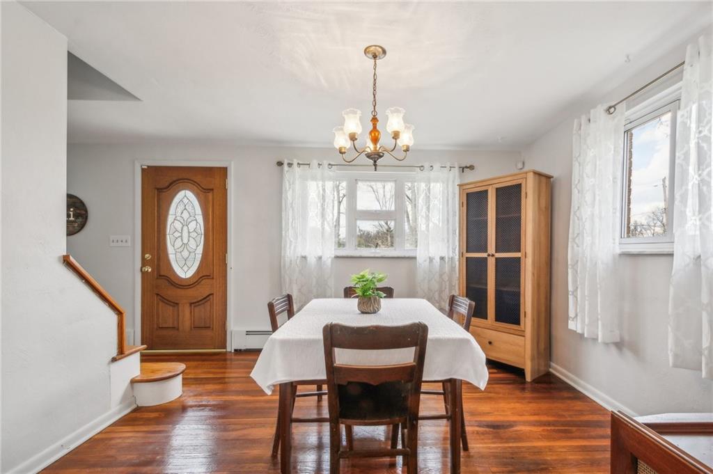 203 Oak Road Pittsburgh, PA 15239 - Photo 10 of 32 a view of a dining room with furniture window and wooden floor