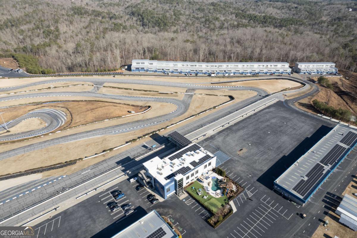 702 Joe Lane Cox Road, Unit 101 Dawsonville, GA 30534 - Photo 11 of 28 a view of a swimming pool with a couch