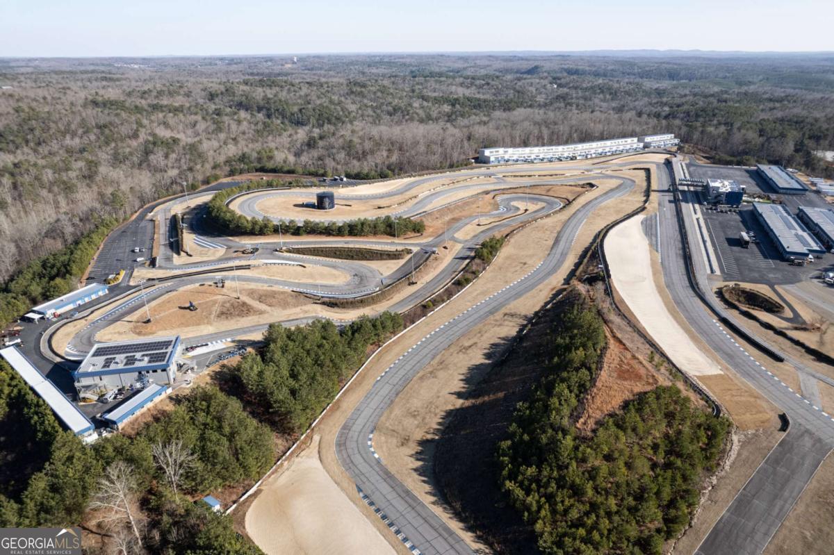 702 Joe Lane Cox Road, Unit 101 Dawsonville, GA 30534 - Photo 12 of 28 a view of a swimming pool with a balcony