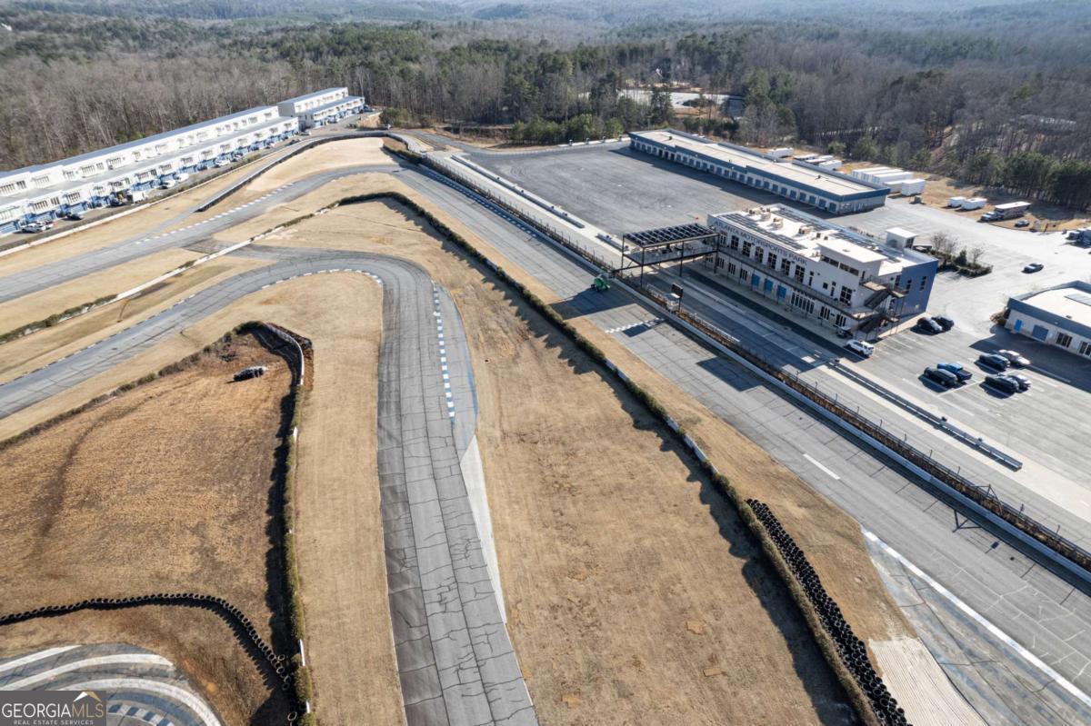 702 Joe Lane Cox Road, Unit 101 Dawsonville, GA 30534 - Photo 13 of 28 a view of a balcony with a floor to ceiling window