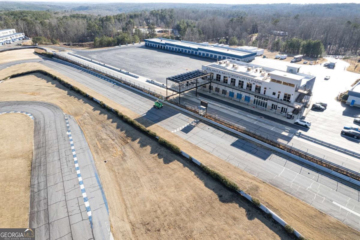 702 Joe Lane Cox Road, Unit 101 Dawsonville, GA 30534 - Photo 14 of 28 a view of a terrace with a bench