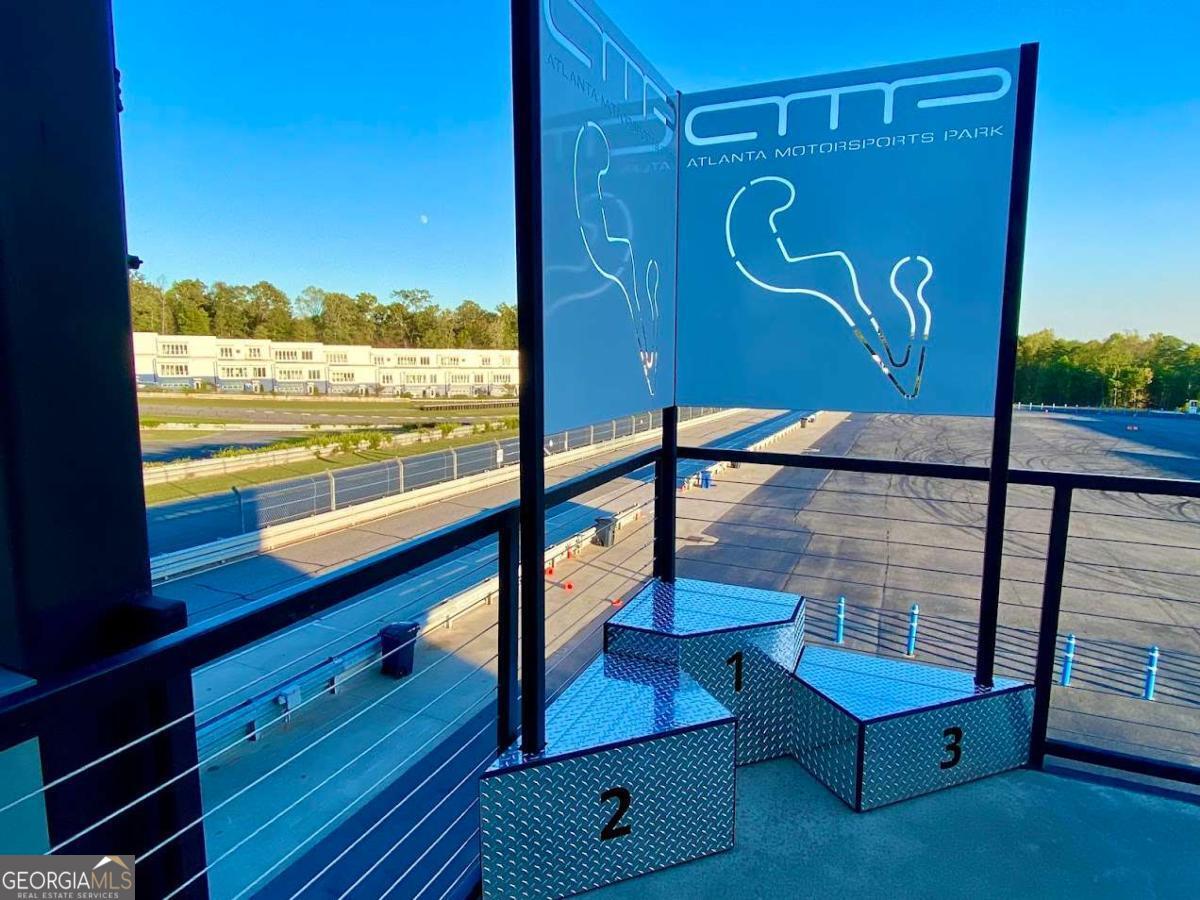 702 Joe Lane Cox Road, Unit 101 Dawsonville, GA 30534 - Photo 16 of 28 a view of a room with wooden floor and windows