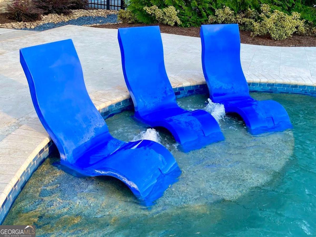 702 Joe Lane Cox Road, Unit 101 Dawsonville, GA 30534 - Photo 27 of 28 a view of a pool in a yard