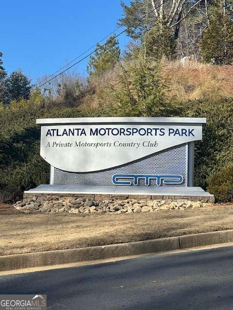 702 Joe Lane Cox Road, Unit 101 Dawsonville, GA 30534 - Photo 4 of 28 a view of a sign board of a building