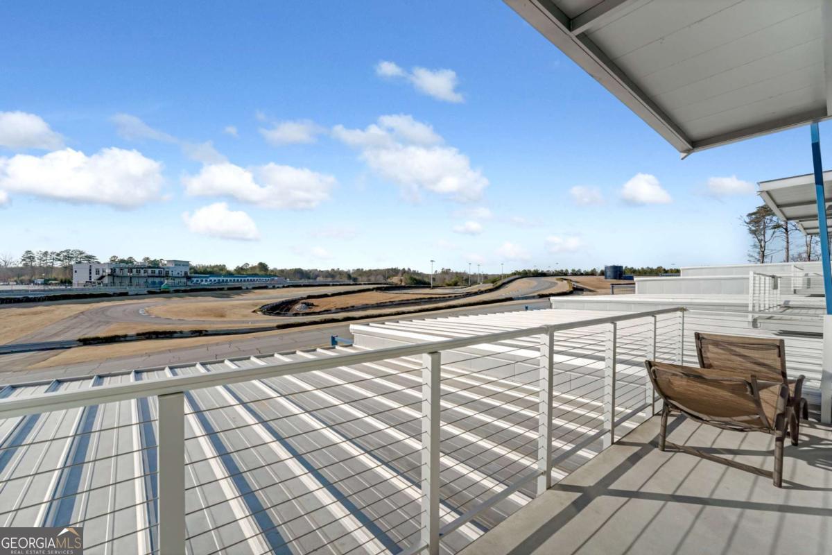 702 Joe Lane Cox Road, Unit 101 Dawsonville, GA 30534 - Photo 6 of 28 a view of a terrace with seating space