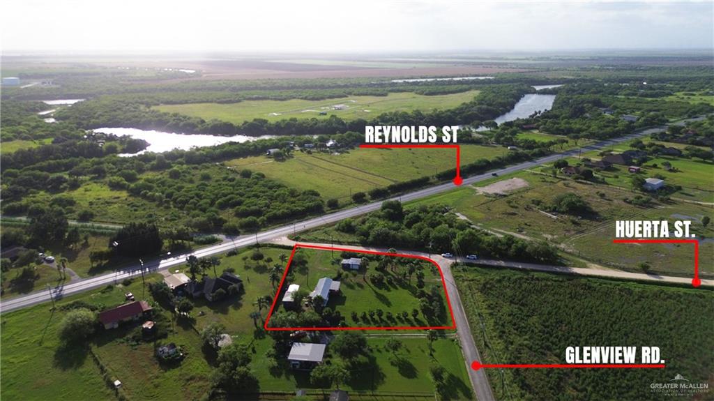 27516 Glenview Road Rio Hondo, TX 78583 - Photo 1 of 26 Aerial view of sparsely populated area with a large body of water and property parcel outlined