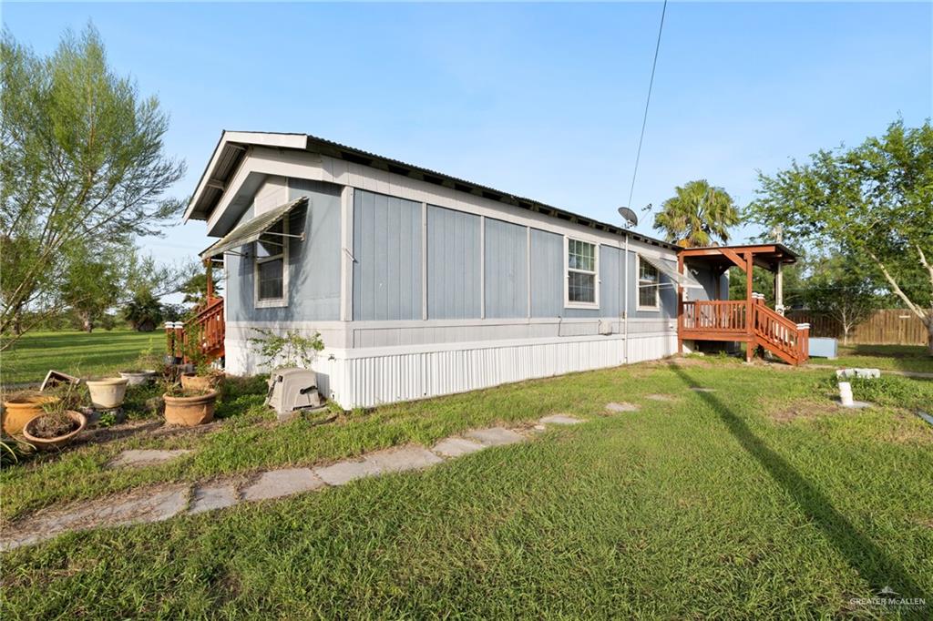 27516 Glenview Road Rio Hondo, TX 78583 - Photo 18 of 26 View of home's exterior featuring a lawn