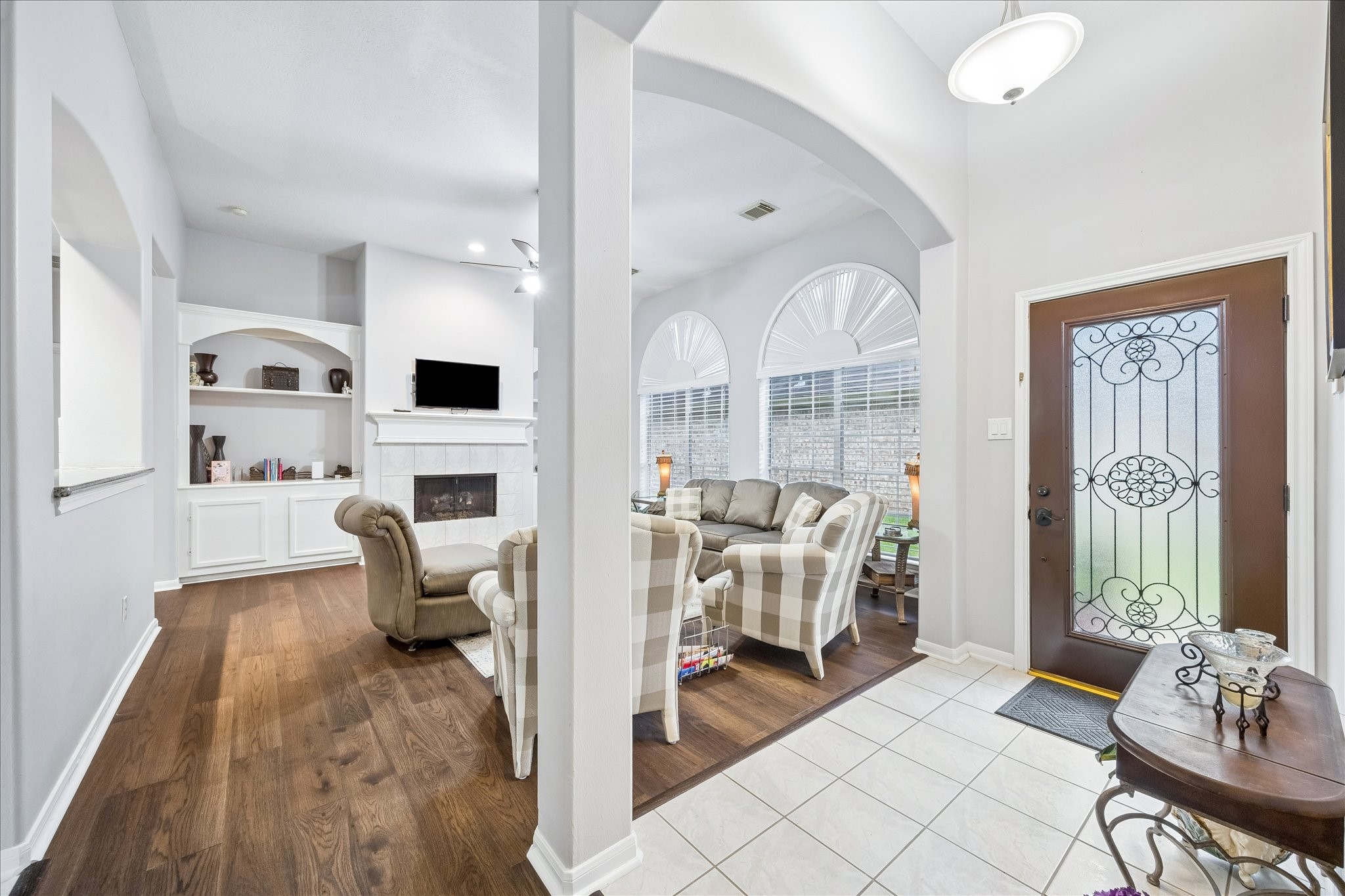 12423 Rutgers Park Court Houston, TX 77058 - Photo 3 of 29 a living room with fireplace furniture and a large window