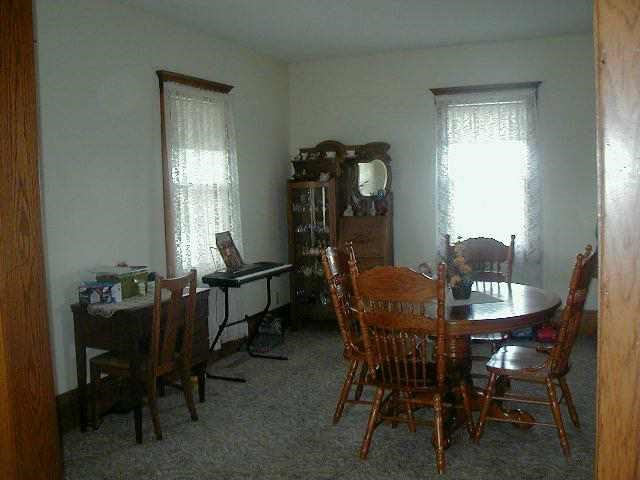 3077 Oakville Road Chadwick, IL 61014 - Photo 7 of 7 a dining room with furniture and window
