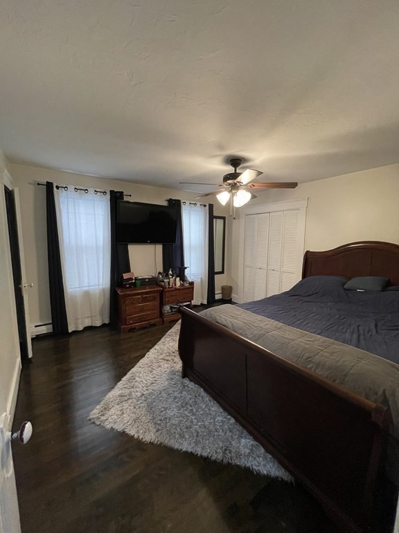 9 Thayer Street Worcester, MA 01603 - Photo 10 of 18 a spacious bedroom with a bed and a view of livingroom