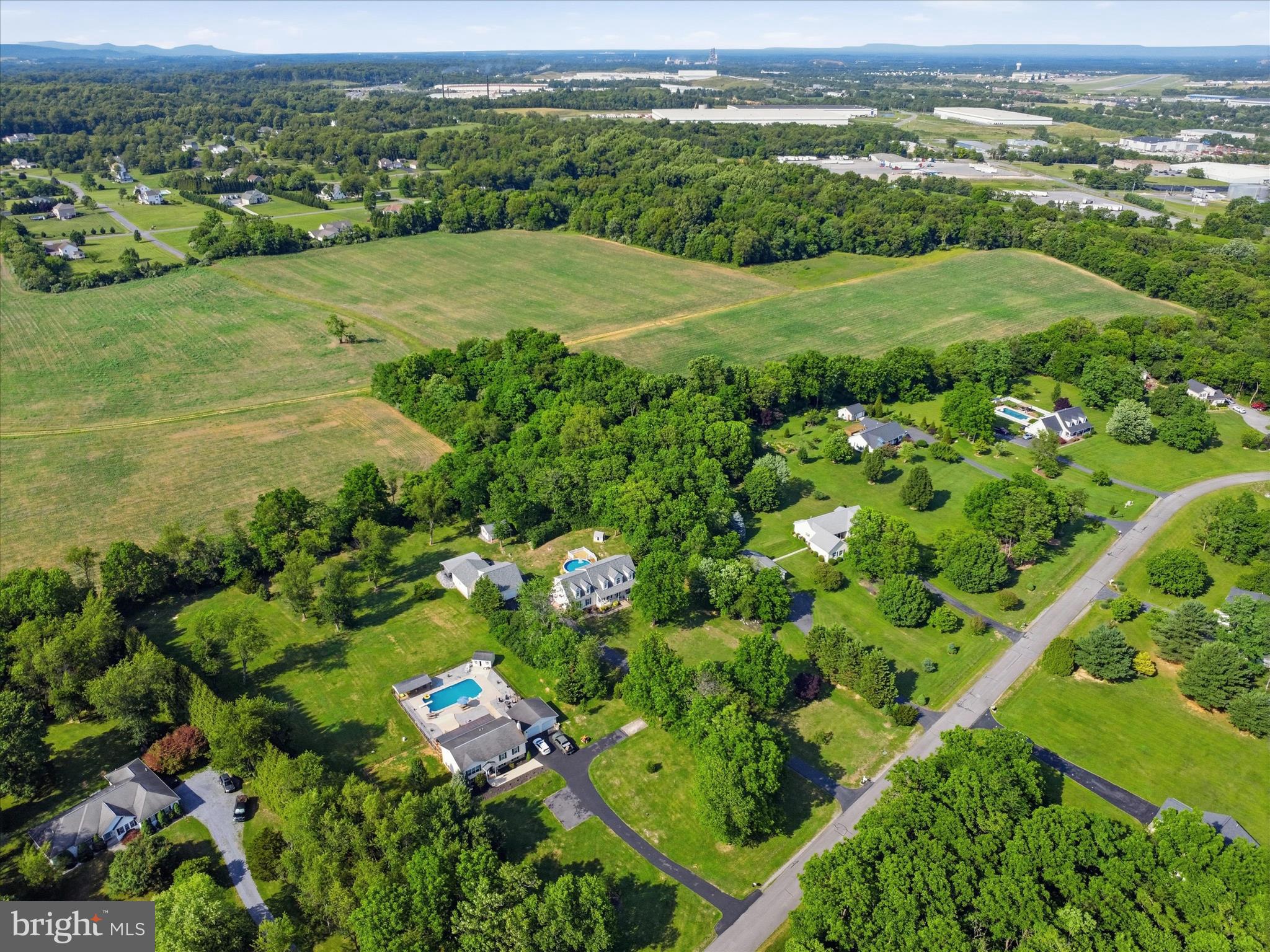 726 Doe Run Road Inwood, WV 25428 - Photo 62 of 68 an aerial view of residential houses with outdoor space and city view