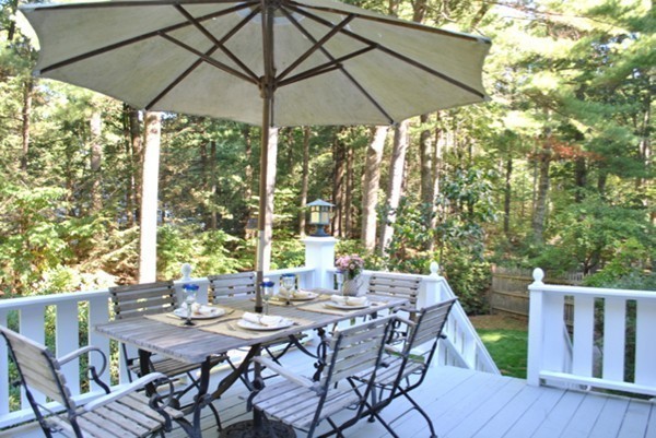 63 Todd Pond Road Lincoln, MA 01773 - Photo 12 of 18 a view of an outdoor space with furniture and umbrella