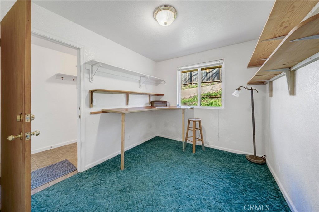 11575 Loch Lomond Road Middletown, CA 95461 - Photo 12 of 38 a view of kitchen with a window and a fireplace