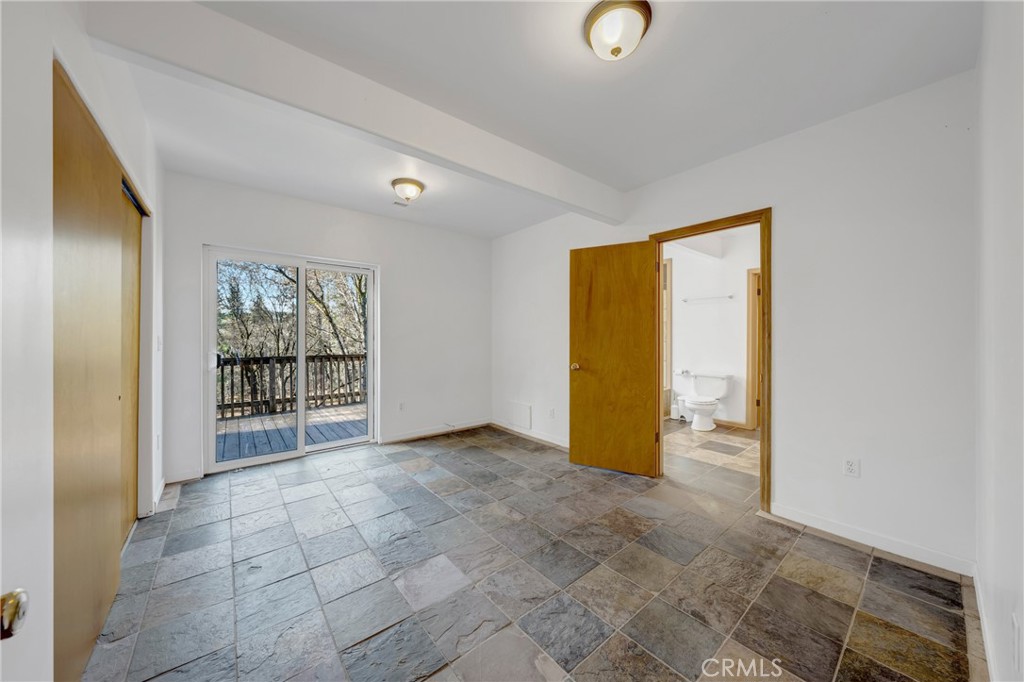 11575 Loch Lomond Road Middletown, CA 95461 - Photo 21 of 38 an empty room with windows and closet
