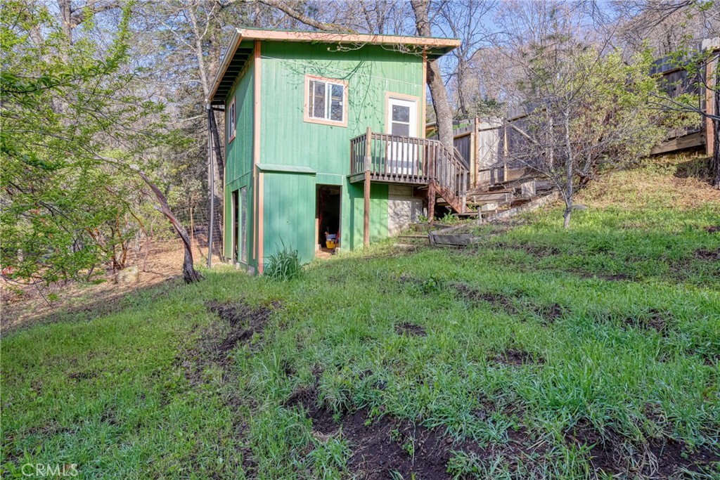 11575 Loch Lomond Road Middletown, CA 95461 - Photo 30 of 38 a view of a house with a yard and plants