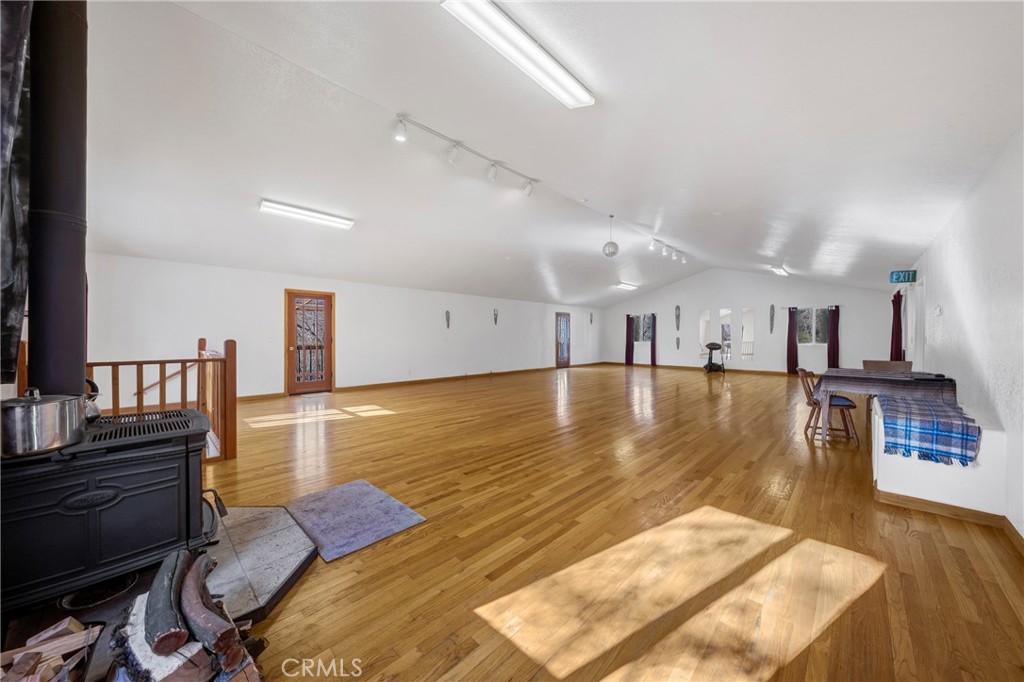 11575 Loch Lomond Road Middletown, CA 95461 - Photo 9 of 38 a view of a living room and kitchen with furniture and wooden floor