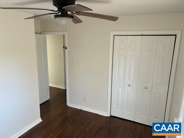 a view of an entryway with wooden floor