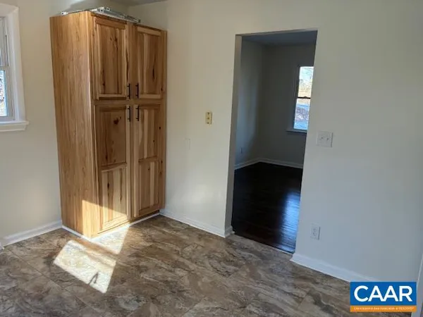a view of entryway with wooden floor