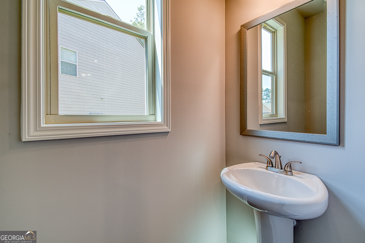181 Depot Landing Road, Unit 28A Auburn, GA 30011 - Photo 11 of 29 a bathroom with a sink and a mirror