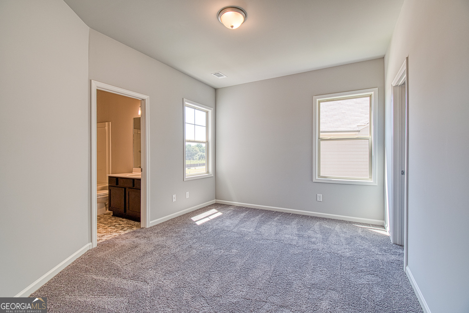 181 Depot Landing Road, Unit 28A Auburn, GA 30011 - Photo 13 of 29 an empty room with windows and closet
