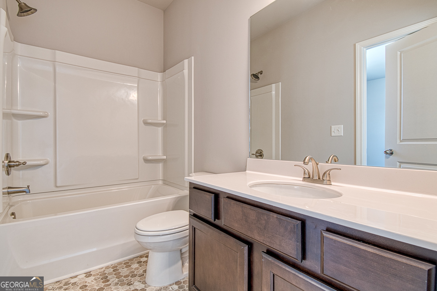 181 Depot Landing Road, Unit 28A Auburn, GA 30011 - Photo 14 of 29 a bathroom with a sink a toilet and a bathtub