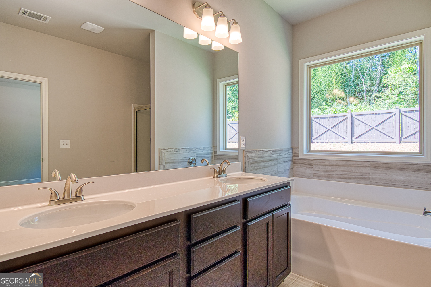 181 Depot Landing Road, Unit 28A Auburn, GA 30011 - Photo 18 of 29 a bathroom with a sink double vanity and a bathtub