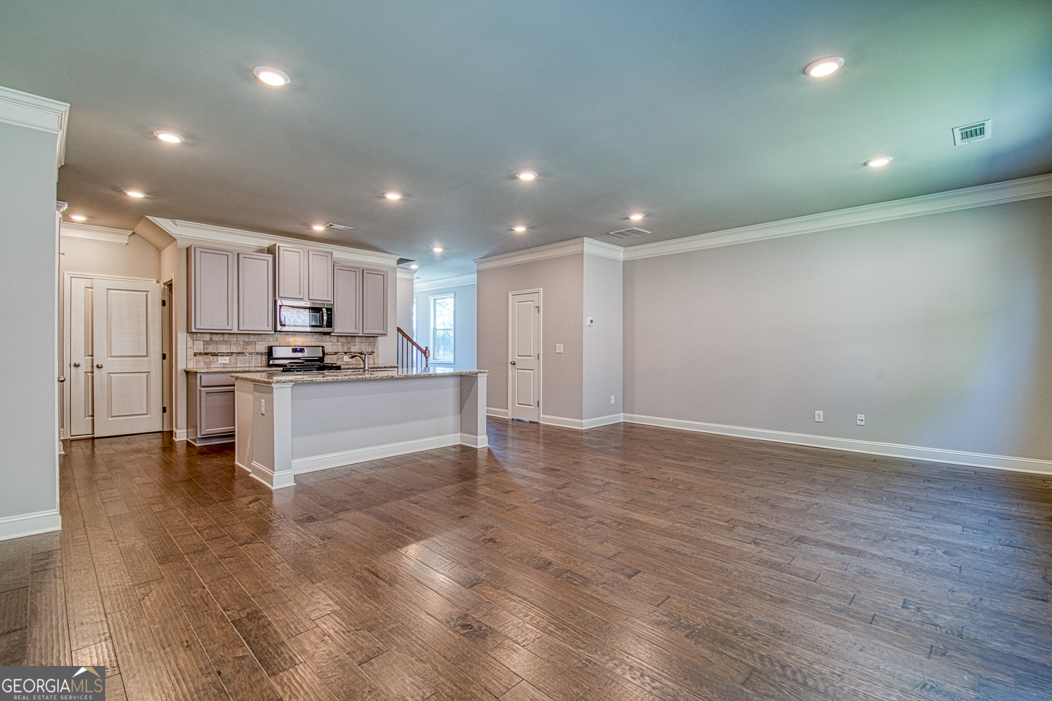 181 Depot Landing Road, Unit 28A Auburn, GA 30011 - Photo 9 of 29 a view of kitchen with granite countertop stainless steel appliances refrigerator oven stove microwave and cabinets