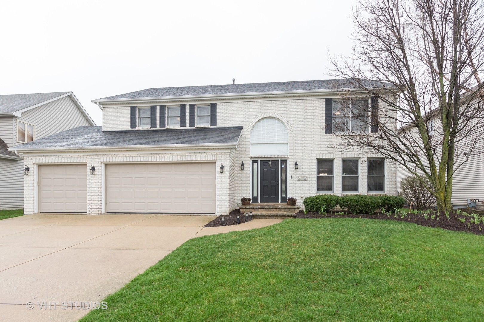 2112 Wicklow Road Naperville, IL 60564 - Photo 1 of 17 a front view of a house with a garden