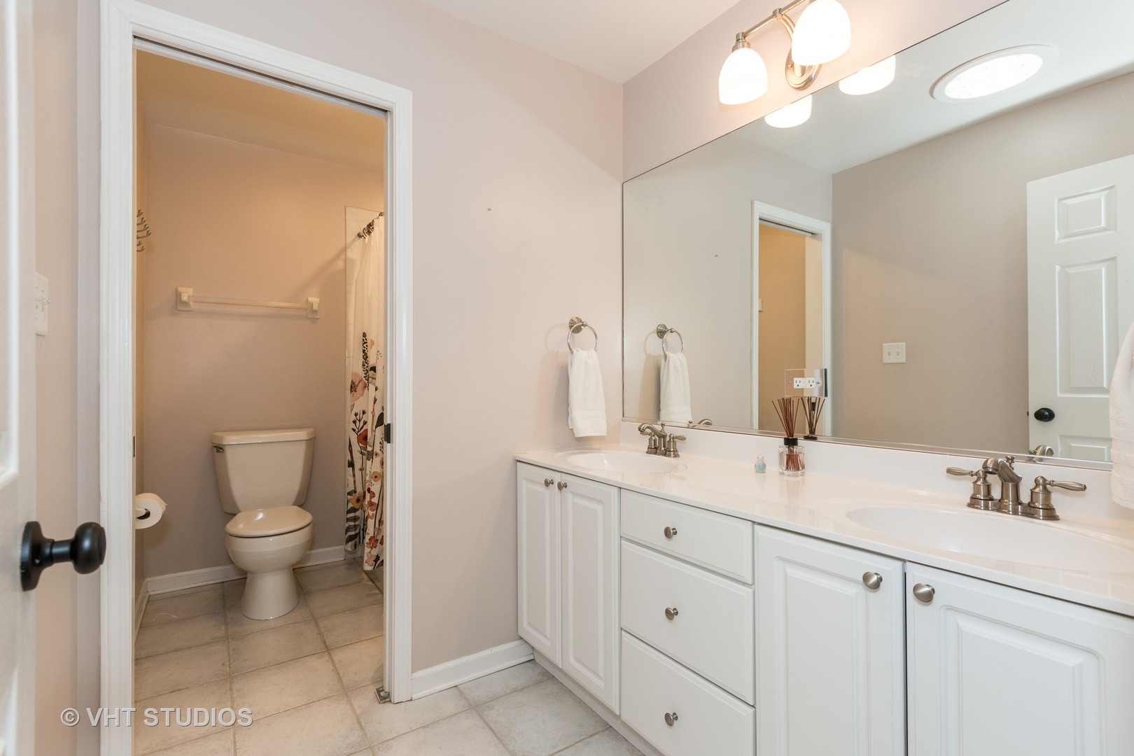 2112 Wicklow Road Naperville, IL 60564 - Photo 14 of 17 a bathroom with a double vanity sink toilet and shower
