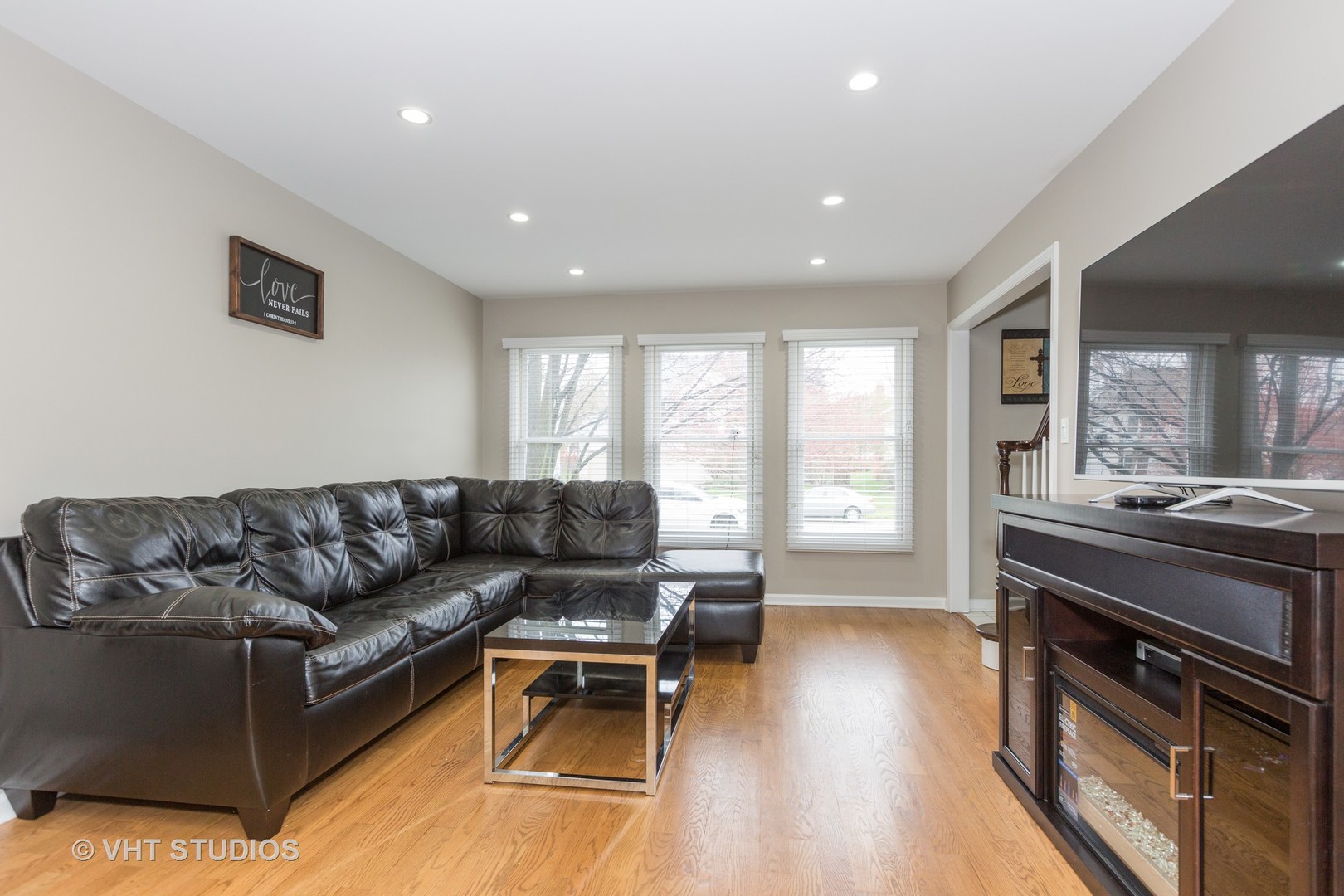 2112 Wicklow Road Naperville, IL 60564 - Photo 3 of 17 a living room with furniture and a flat screen tv