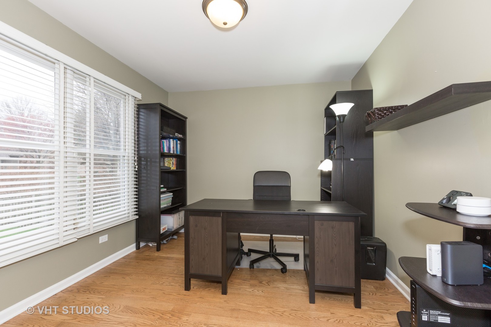 2112 Wicklow Road Naperville, IL 60564 - Photo 8 of 17 a view of a workspace with furniture and a window